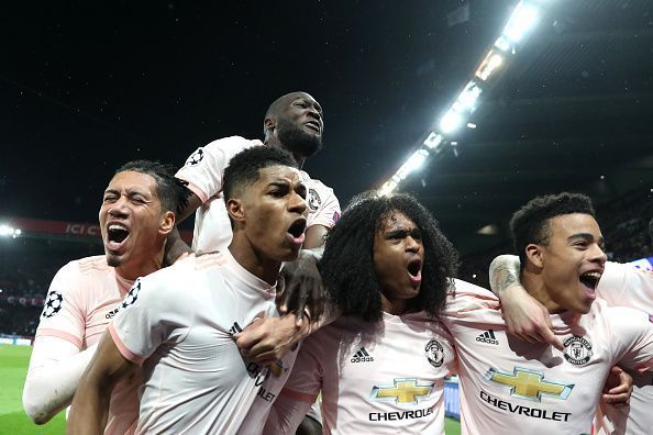 Rashford (second from left) and his teammates celebrate the 21-year-old&#039;s stoppage-time penalty