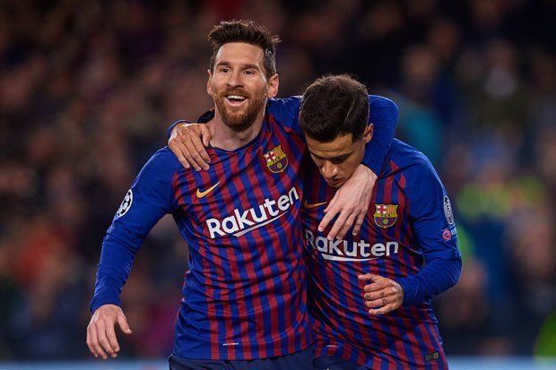 Coutinho with Barcelona teammate Lionel Messi