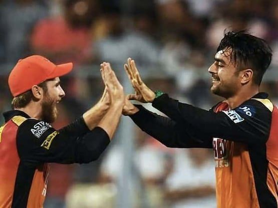 Rashid Khan celebrating the fall of a wicket with Kane Williamson