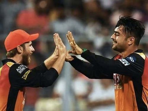 Rashid Khan celebrating the fall of a wicket with Kane Williamson