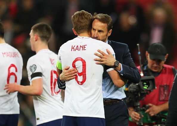 Kane is embraced by manager Southgate at the full-time whistle after an impressive all-round display