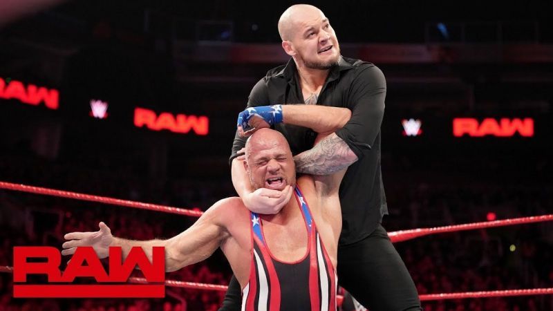 Baron Corbin puts Kurt Angle in a chin lock on Raw.
