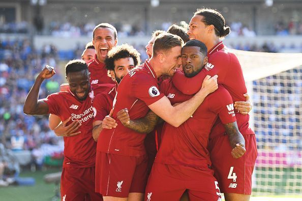 Liverpool players celebrate after Wijnaldum&#039;s goal against Cardiff