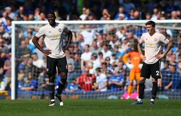 Paul Pogba (left) dejected after Manchester United&#039;s loss to Everton