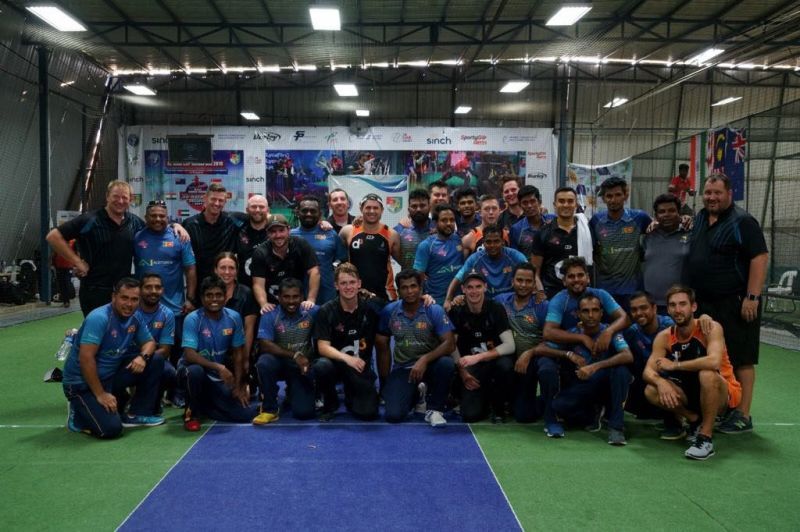 New Zealand and Sri Lanka pose for a group photo after the Grand Final (Image Courtesy: Singapore Cricket Association)