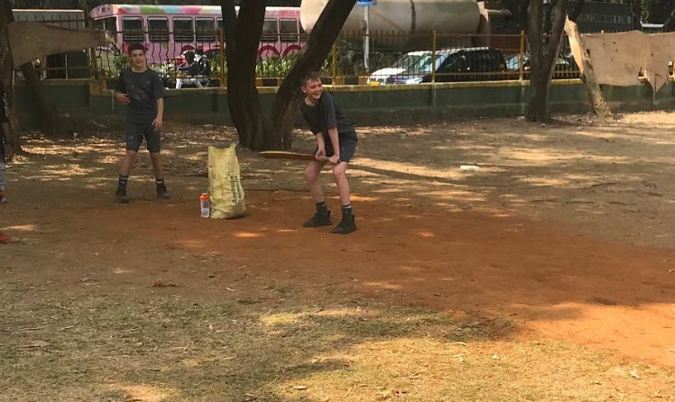 Premier League Youth Teams playing cricket with children from the orphanage