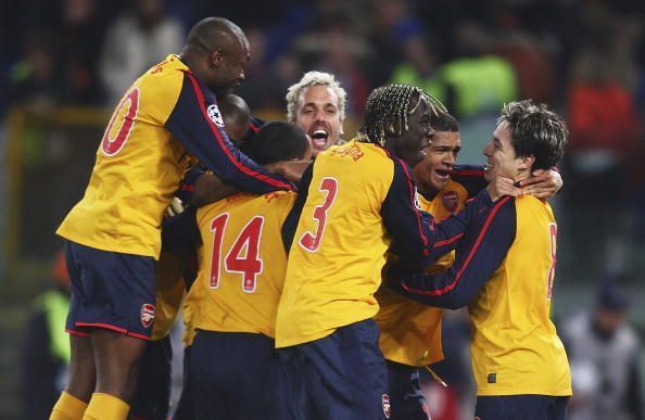 Arsenal players celebrate after winning on penalties