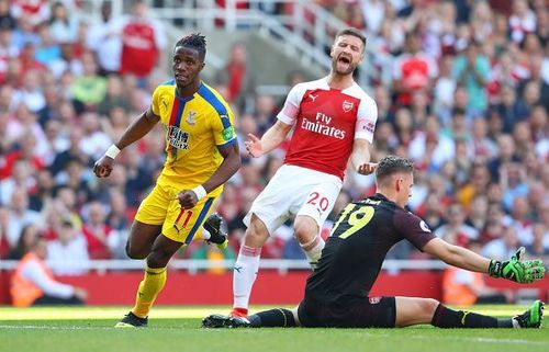 Mustafi reacts after Crystal Palace's Wilfried Zaha scores a goal against Arsenal