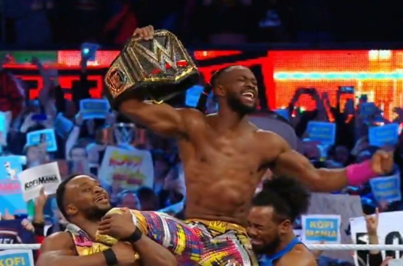 Kofi Kingston with his New Day brothers after Kingston&#039;s WWE Championship win at WrestleMania 35