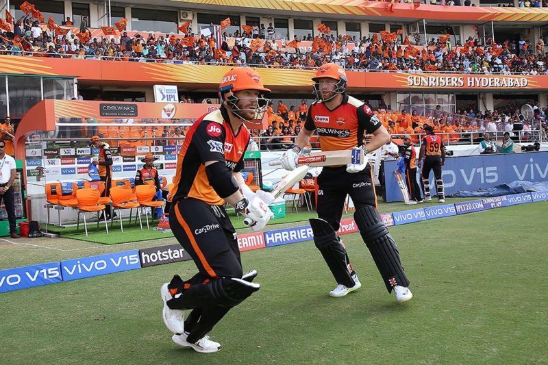 Warner and Bairstow walk out to bat.