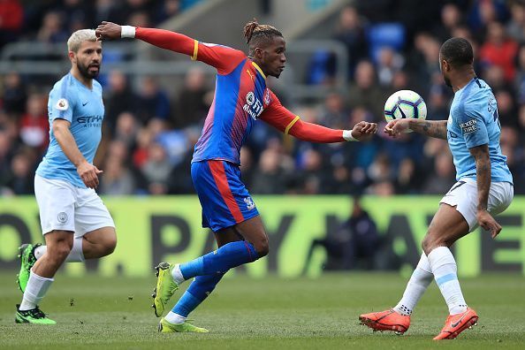 Wilfried Zaha in action against Manchester City - Premier League