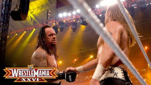 Undertaker shaking Shawn's hand after retiring him