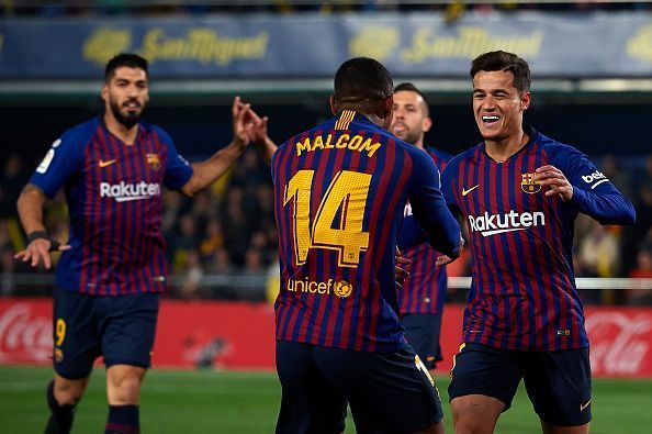 Malcom celebrates with Coutinho after creating his second La Liga assist