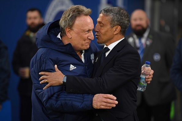 Neil Warnock and Chris Hughton embracing each other before kick-off at the American Express Community Stadium.