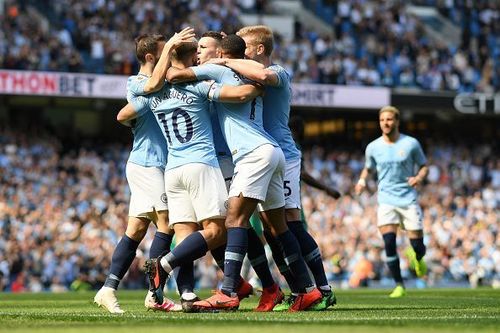 Manchester City players celebrate after Phil Foden's goal against Tottenham Hotspur during their Premier League match at the Etihad Stadium on Saturday