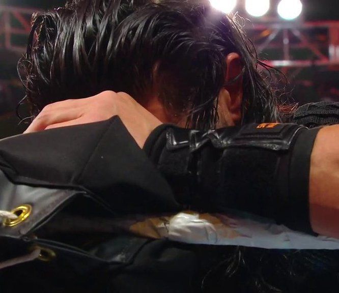 An emotional Roman Reigns prays after defeating Drew McIntyre at WrestleMania 35