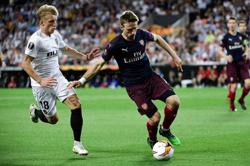 Monreal, during a duel for possession with Valencia&#039;s Daniel Wass