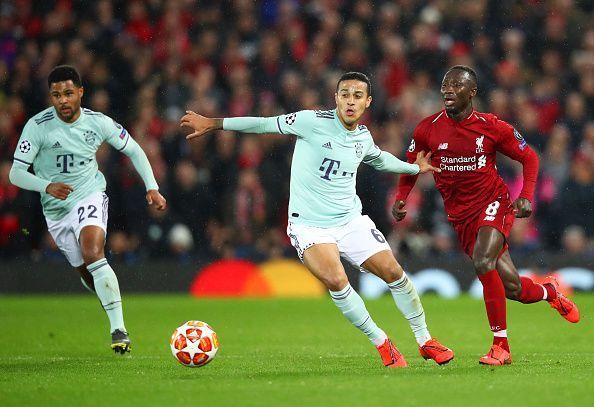 Thiago Alcantara (centre) in action against Liverpool