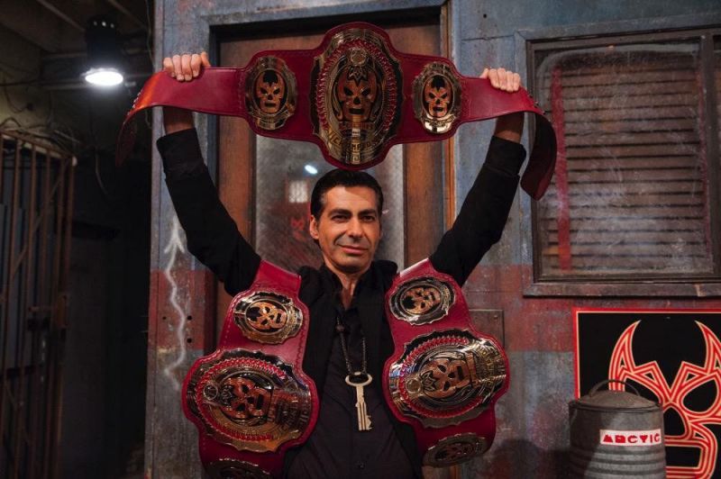 Dario Cueto holds the Lucha Underground Trios Championships