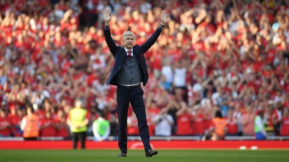 Arsene Wenger waving at the crowd at his farewell.