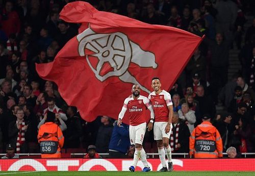 Lacazette and Aubameyang celebrate after an eventful evening's work saw them beat Valencia 3-1