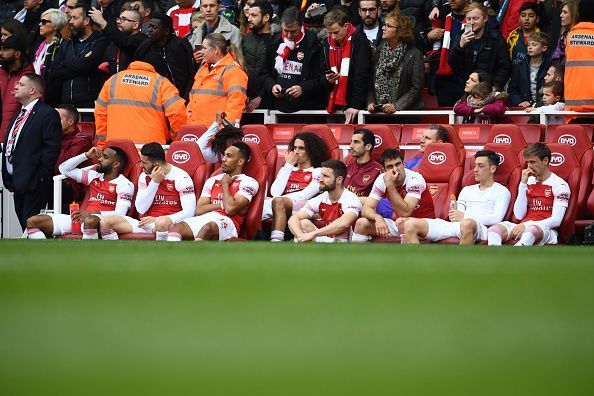 Arsenal players look dejected after failing to secure a win over Brighton