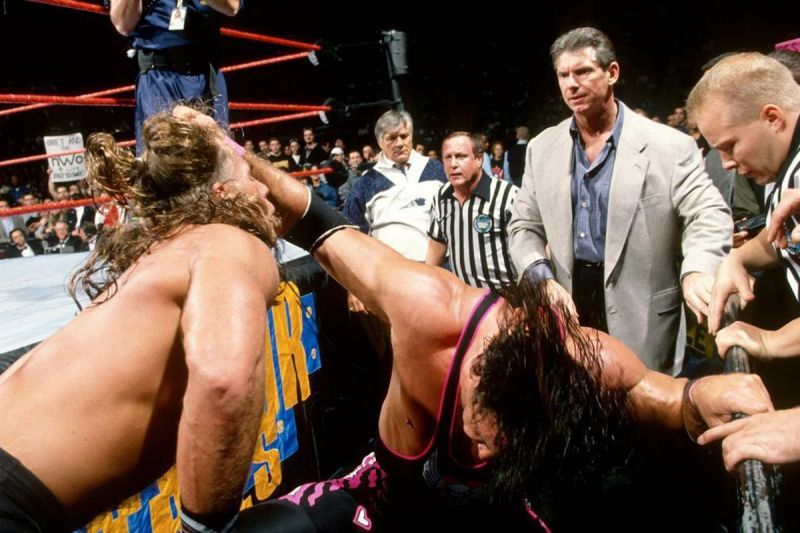 Bret Hart brawls with Shawn Michaels as Vince McMahon looks on at the 1997 Survivor Series