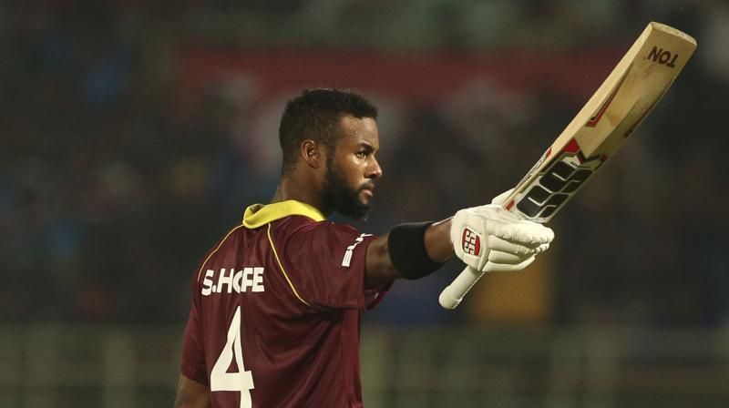 Shai Hope acknowledging the applause after scoring a century