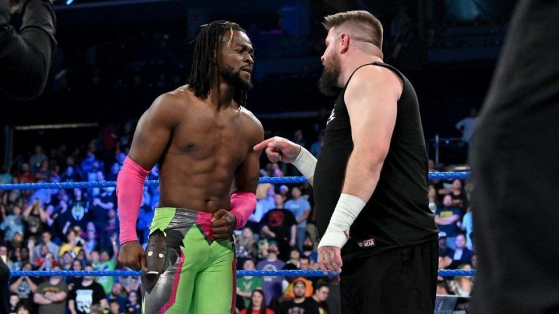 Allies turned enemies Kofi Kingston and Kevin Owens have a stare down in the ring.