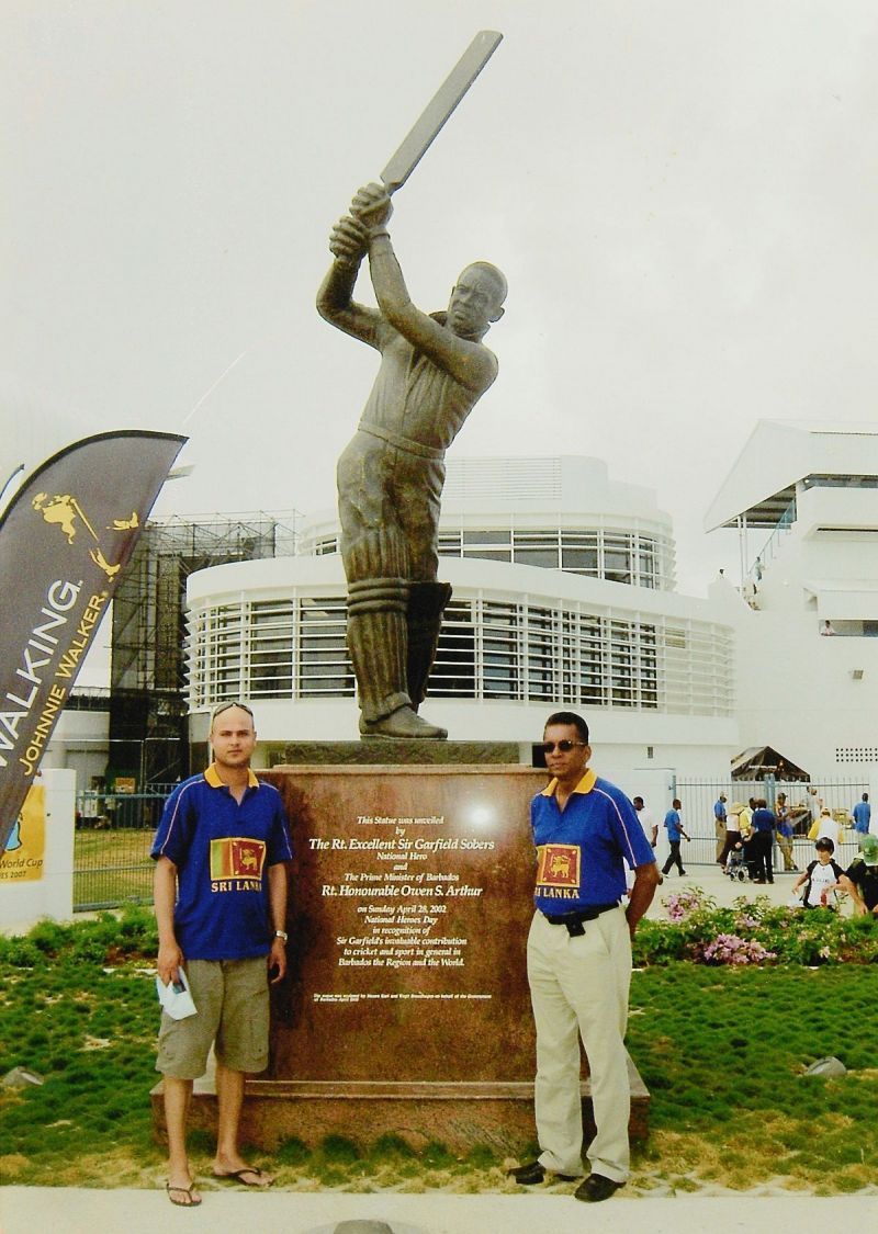 Snap with the greatest: My friend, Adrian (left) and yours truly standing before the statue of Sir Garfield Sobers at the Kensington Oval in Bridgetown, Barbados prior to the start of the 2007 ICC Cricket World Cup final on 28 April 2007. (Â© Ranjan Mellawa)