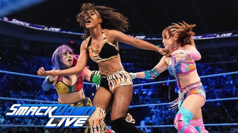 Asuka and Kairi Sane double team a local competitor (WWE&#039;s term for unnamed enhancement talent.)
