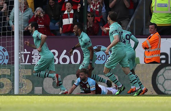 Arsenal players celebrate a goal in their final game of the season in the premier league against Burnley