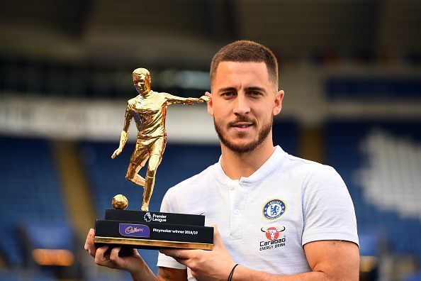 Hazard with his award for the league&#039;s playmaker of the season