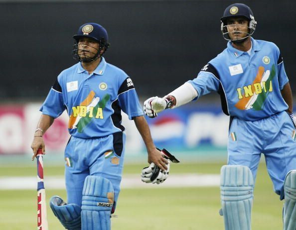 Sachin Tendulkar (left) of India is given a pat on the back by his captain