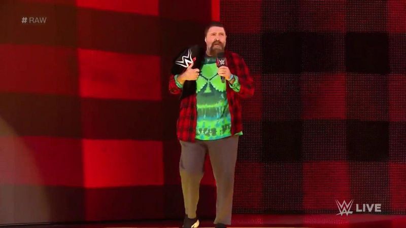 Mick Foley walking out with the title