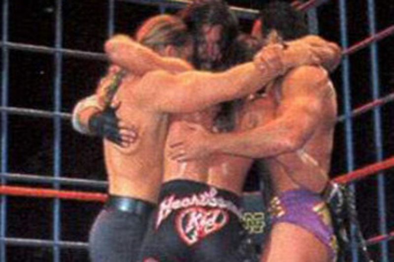 Triple H, Shawn Michaels, Kevin Nash, and Scott Hall embrace in the ring after Nash and Hall's final WWE match.