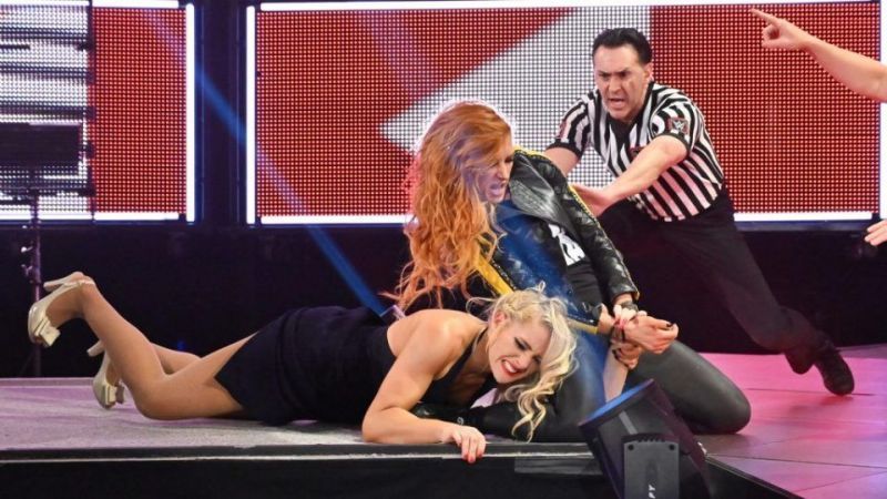 Lacey Evans writhes in Becky Lynch&#039;s unforgiving Disarm her finishing move. Will history repeat itself at the MITB PPV, or will Lacey Evans pull off the upset win?