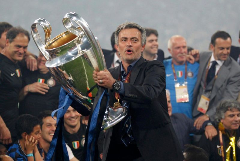 Mourinho with the Champions League title he won with Inter Milan in 2009-10