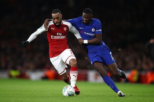 Alexandre Lacazette and Antonio Rudiger in action