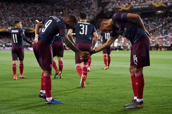 The pair celebrate one of their goals during Arsenal's 4-2 win over Valencia last month