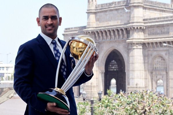 MS Dhoni with the 2011 ICC Cricket World Cup Trophy