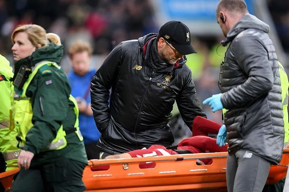 Klopp comforts top goalscorer, Salah, after he was stretchered off following a head injury