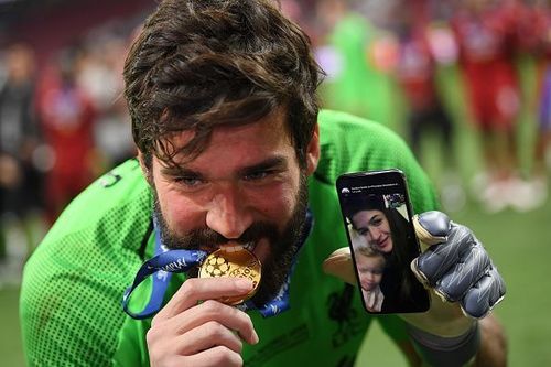 Alisson Becket celebrates his Champions League win.