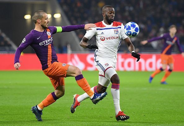 David Silva and Tanguy Ndombele tussling for the ball