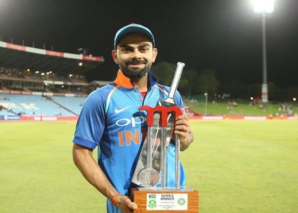 Virat Kohli with The Momentum series trophy, 2018.