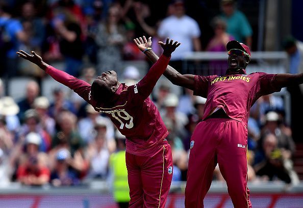West Indies&#039; Sheldon Cottrell celebrating with a teammate