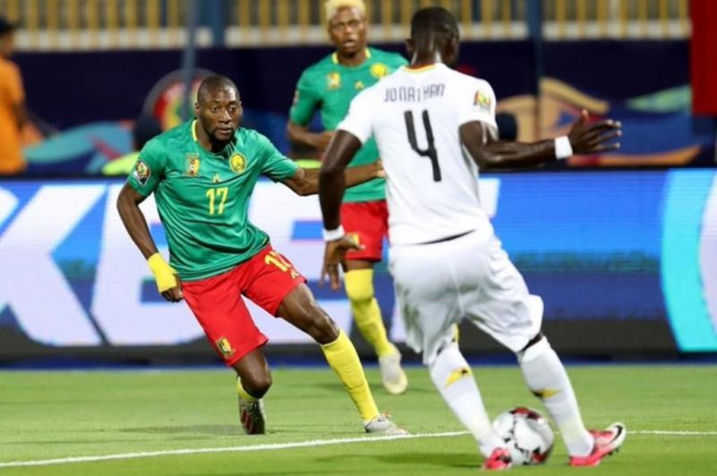 Jonathan Mensah (r), he played a crucial role in keeping the rampaging Indomitable Lions attack at bay