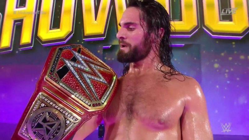 Seth Rollins holds up the Universal Championship after taking down Brock Lesnar at Super ShowDown.