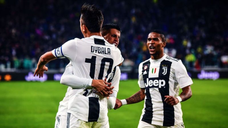Paulo Dybala, Joao Cancelo and Douglas Costa of Juventus