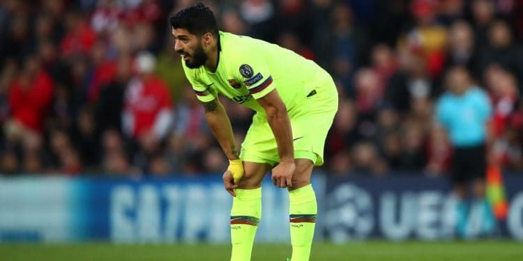 A dejected Suarez after the Champions League exit against Liverpool at Anfield
